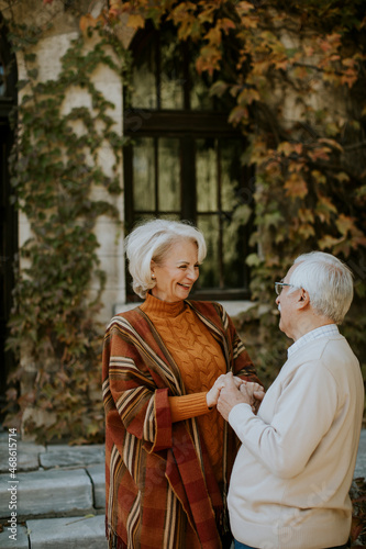 Senior couple embracing in autumn park