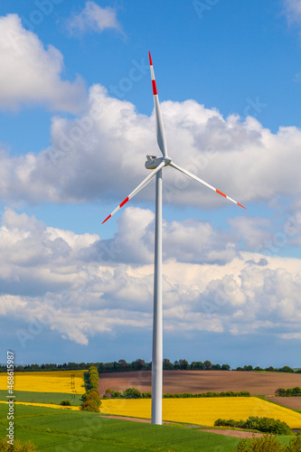 wind turbine generating electricity on blue sky