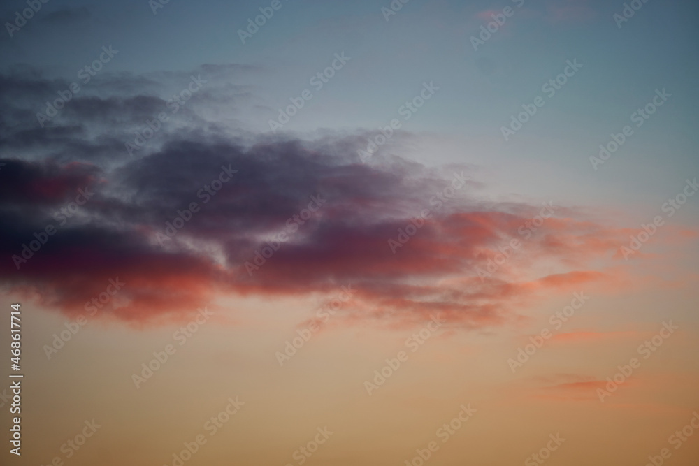 Beautiful sunset sky with clouds, bright colors. Sky texture, abstract nature background