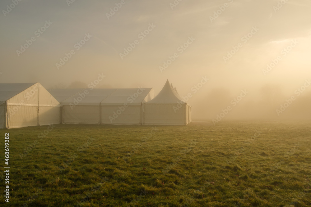 Marquee in the morning mist at Petworth park, West Sussex