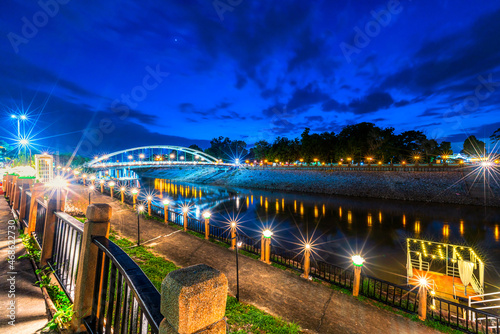 The light Bridge over the Nan River (Wat Phra Si Rattana Mahathat also - Chan Palace) New Landmark It is a major tourist is Public places attraction Phitsanulok,Thailand.Twilight dramatic sunset sky