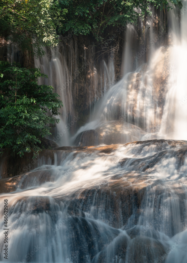 Sai Yok Noi waterfall flowing on limestone in tropical rainforest at national park Sai Yok Noi waterfall flowing on limestone in tropical rainforest at national park