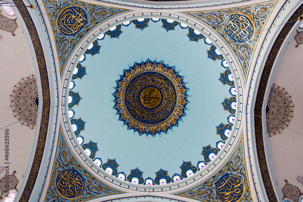 Low angle view of ceiling with ornamentation in Çamlıca Mosque. Inside decoration and .architectural details the new Camlica Mosque in Turkey