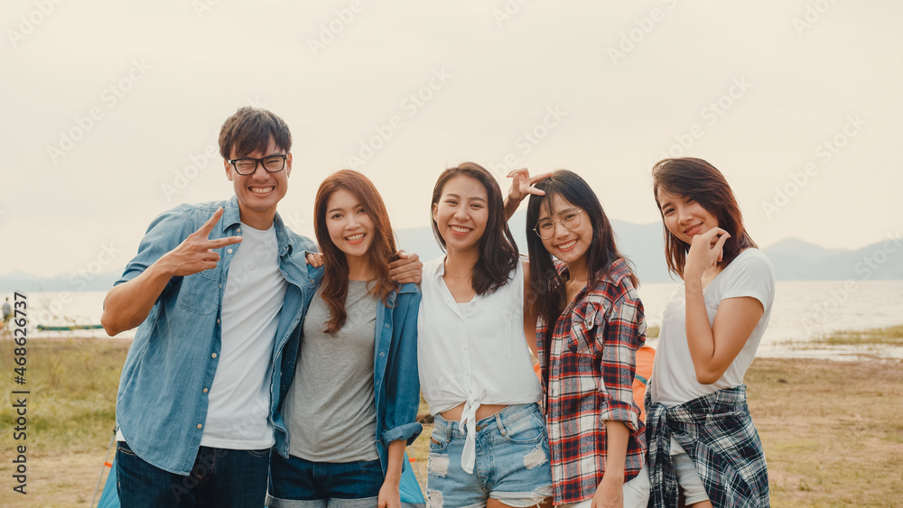 Group of Asia best friends teenagers take picture with automatic camera enjoy happy moments