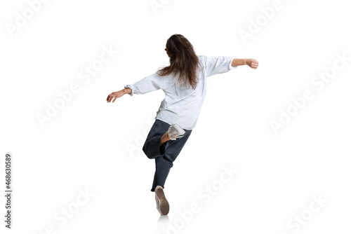 Back view. One woman in casual wear running isolated on white background. Art, motion, action, flexibility, inspiration concept.