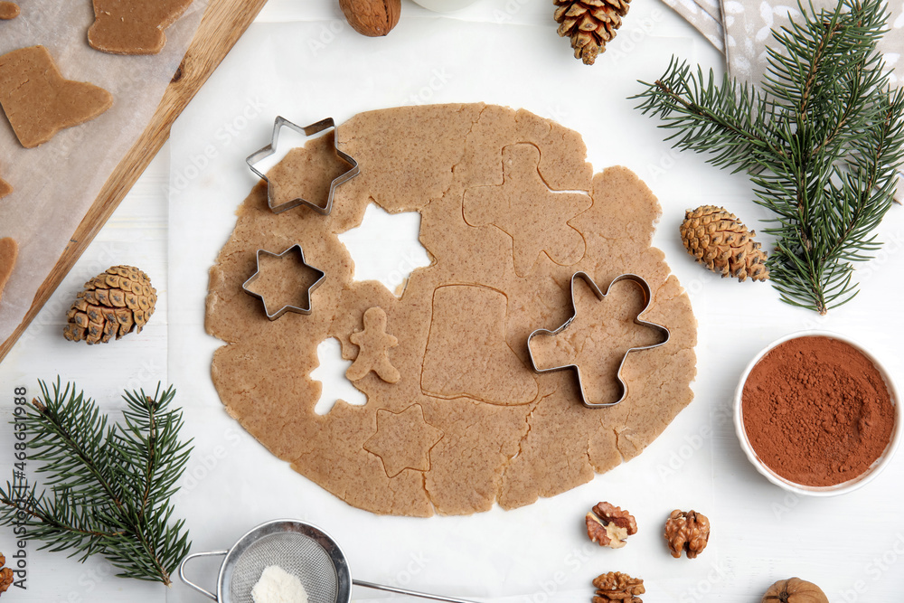 Homemade Christmas cookies. Flat lay composition with dough on white table Homemade Christmas cookies. Flat lay composition with dough on white table