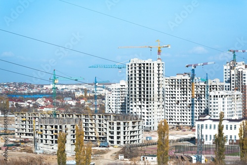 The architectural complex of residential buildings on sky background