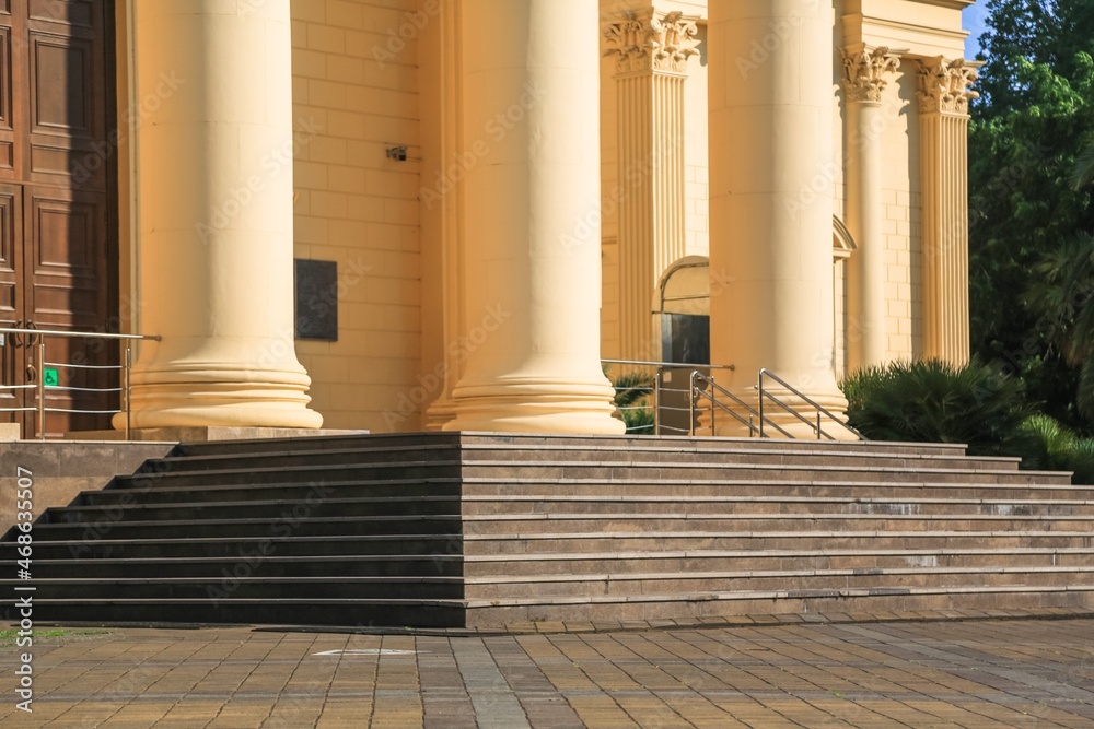 Architectural detail of marble steps and ionic order columns Architectural detail of marble steps and ionic order columns