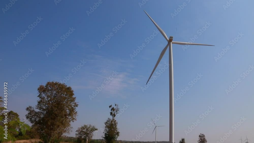 Power of wind turbine generating electricity clean energy on mountain and sky.Global ecology.Clean energy concept Power of wind turbine generating electricity clean energy on mountain and sky.Global ecology.Clean energy concept