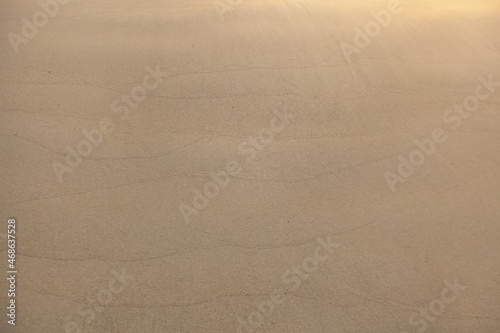 Abstract sand texture on beach background in summer