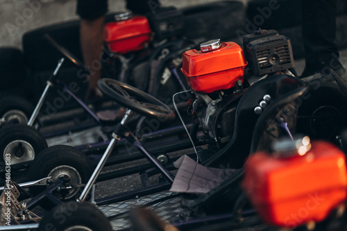 Karting competition or racing cars riding for victory on a racetrack