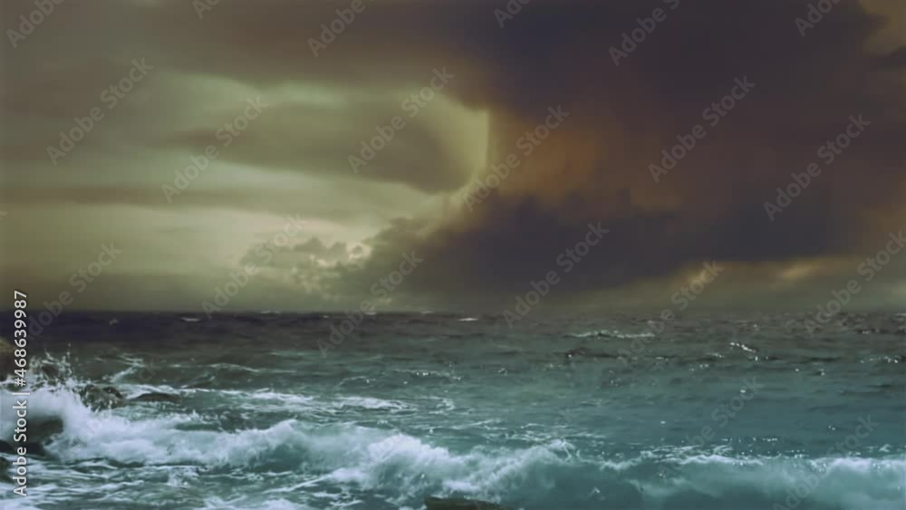 Dramatic sea storm time-lapse with multiple lightning strikes and waves hitting rock on the shore.