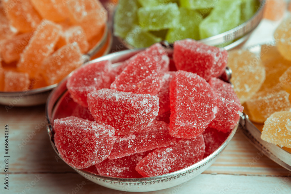 Dessert marmalade in the form of lemon and orange slices. The sweetness of jelly candy. Dessert marmalade in the form of lemon and orange slices. The sweetness of jelly candy.
