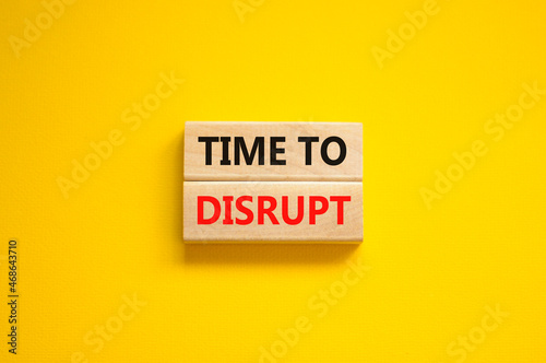 Time to disrupt symbol. Concept words Time to disrupt on wooden blocks on a beautiful yellow background. Business and time to disrupt concept. Copy space. photo