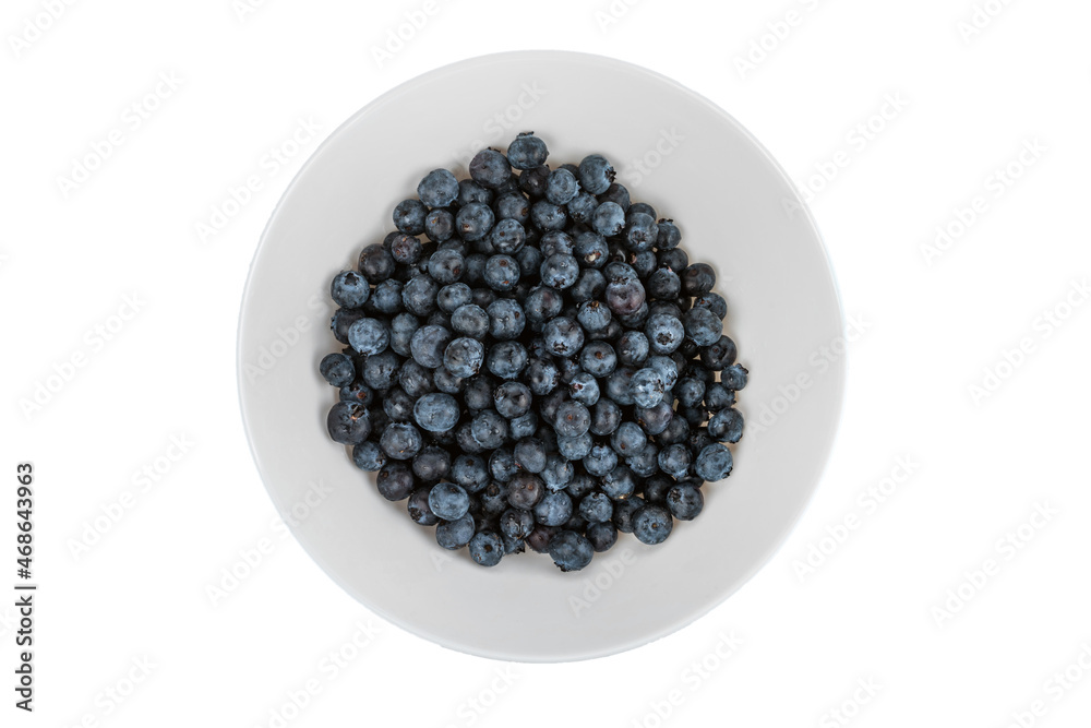 Ripe blueberries in a white plate. isolated on white background. Ripe blueberries in a white plate. isolated on white background.