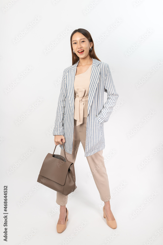 Photograph of a young asian office lady in her office outfit with a bag, focus on different mood and expression Photograph of a young asian office lady in her office outfit with a bag, focus on different mood and expression