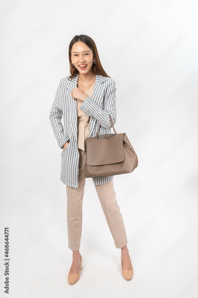 Photograph of a young asian office lady in her office outfit with a bag, focus on different mood and expression Photograph of a young asian office lady in her office outfit with a bag, focus on different mood and expression