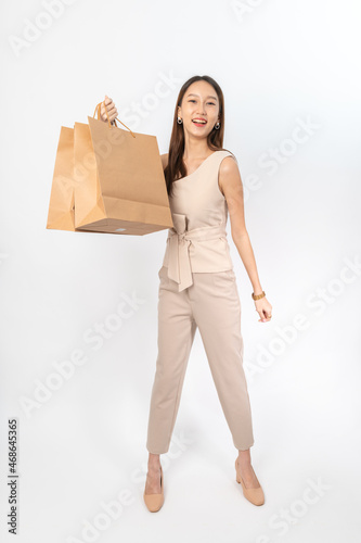 A series of photo collection focusing on the moments, expression and gestures of an asian office lady with brown shopping bag that also look like delivery bag. All are full body, high resolution shots
