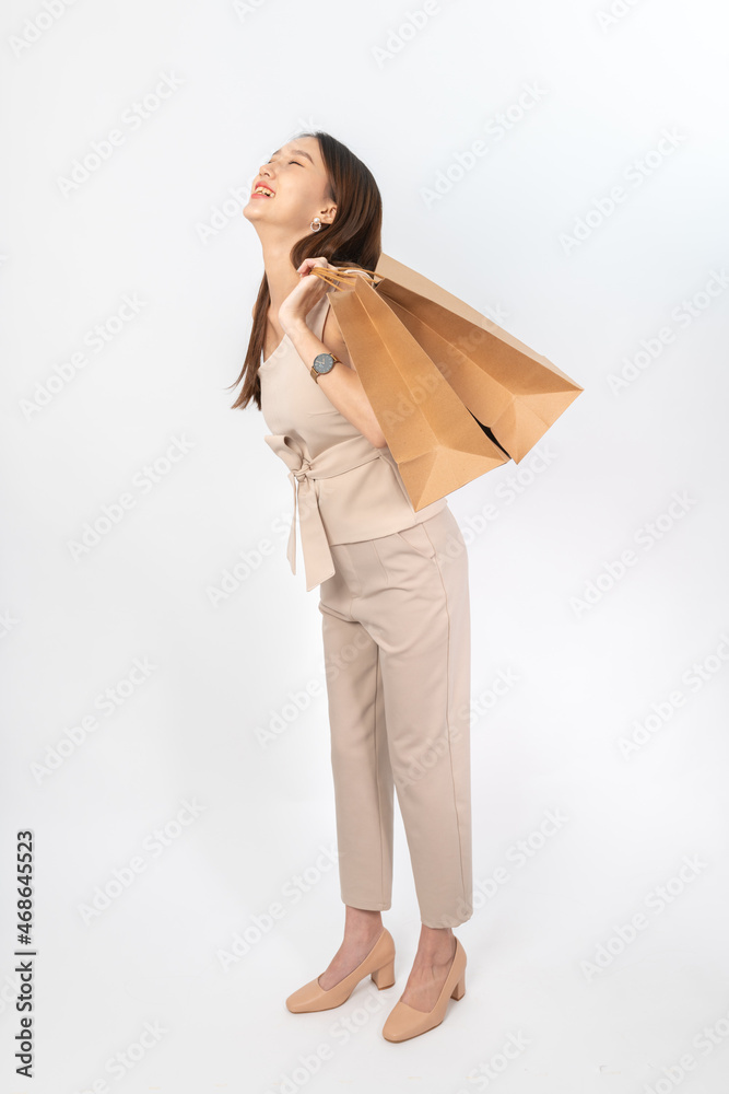 A series of photo collection focusing on the moments, expression and gestures of an asian office lady with brown shopping bag that also look like delivery bag. All are full body, high resolution shots A series of photo collection focusing on the moments, expression and gestures of an asian office lady with brown shopping bag that also look like delivery bag. All are full body, high resolution shots