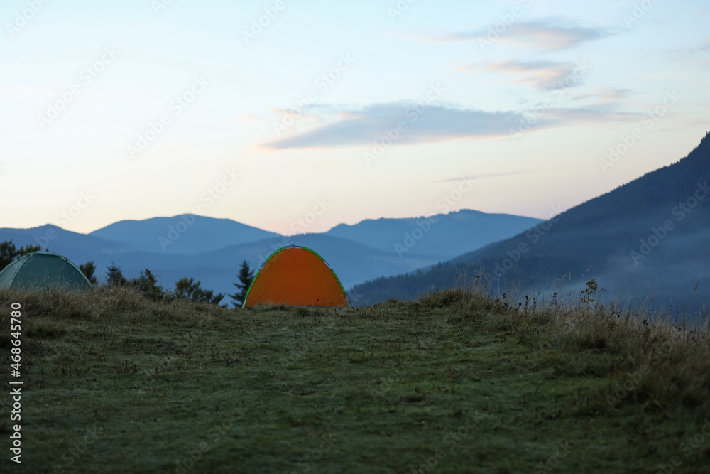 Camping tents in mountains on early morning