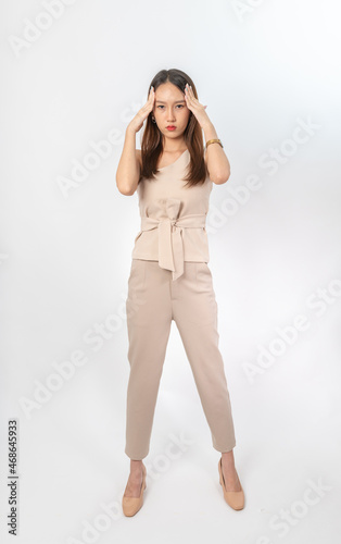 Photograph of a young asian office lady in her office suit. This is part of a series photo collection focusing on the moments, expression and gestures of an asian office lady.