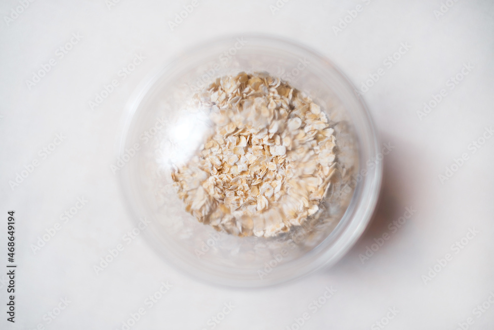 Healthy takeaway food. Oatmeal in a transparent plastic container. Top view. Healthy takeaway food. Oatmeal in a transparent plastic container. Top view.