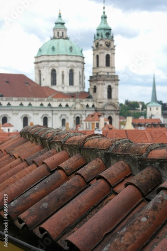   Сlay roof tiles, background of the domes of baroque, churches, inspiring citycsape view of great city Prague. photo