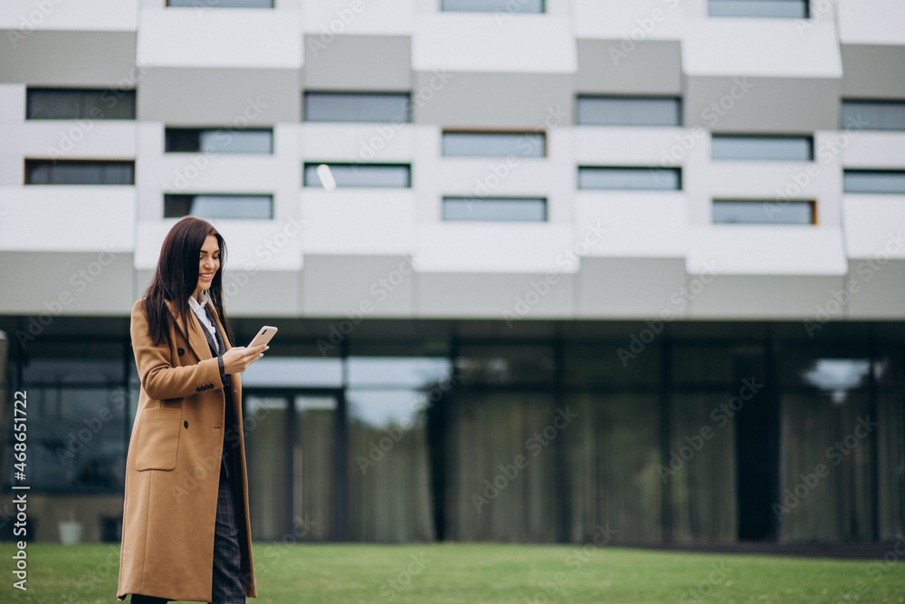 Fototapeta premium Young business woman using phone