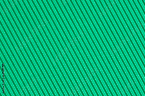The texture of wavy corrugated craft paper - dark green