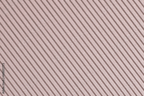 The texture of wavy corrugated decorative cardboard paper - light brown