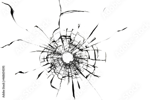 Shot hole, texture of cracks on the glass. Broken windshield. Damaged car window.