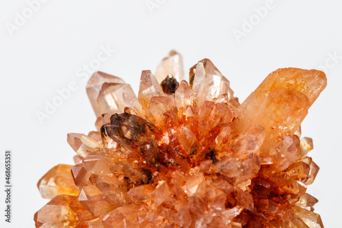 Macro of mineral stone Creedite on microcline on white background photo