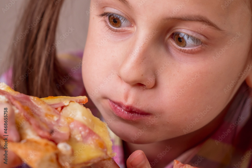 Funny image of young beautiful attractive girl eat street food pizza. Selective focus on eyes.