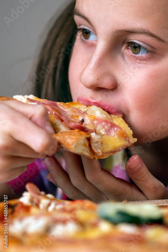 Portrait of young beautiful attractive girl eat street food pizza