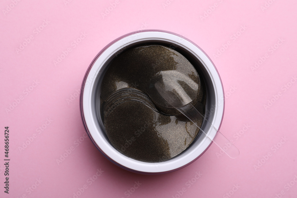 Package of under eye patches on pink background, top view. Cosmetic product Package of under eye patches on pink background, top view. Cosmetic product
