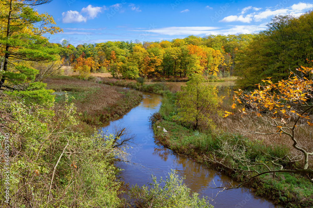 Hendrie Park Valley trail across the marsh during autumn, Burlington Ontario Hendrie Park Valley trail across the marsh during autumn, Burlington Ontario