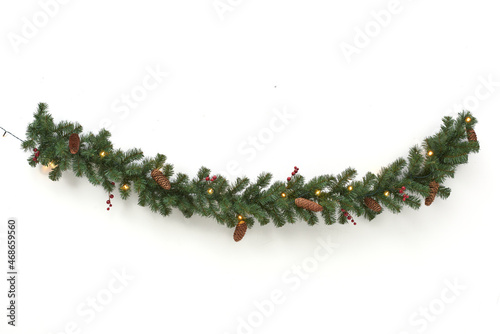 green garland with lights and pine cones