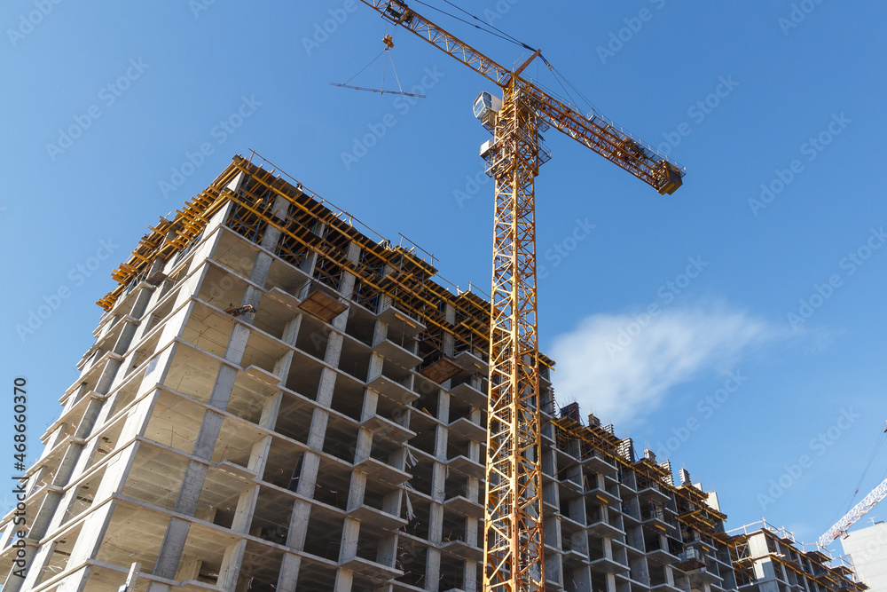 Residential building. Construction of a building using concrete construction technology. High brick residental building Residential building. Construction of a building using concrete construction technology. High brick residental building