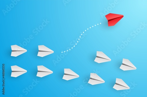 Individuality concept. Individual and unique leader red paper plane flies to the side