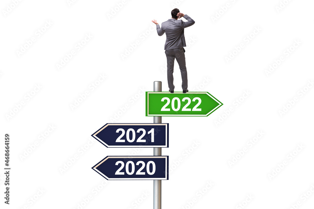 Businessman on the signpost from 2021 to 2022 Businessman on the signpost from 2021 to 2022