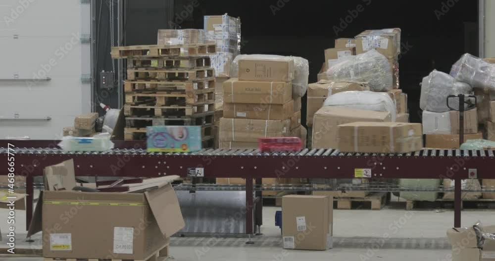 Boxes Parcels Packages Transport at Fast Conveyer in Sorting Postal Warehouse Boxes Parcels Packages Transport at Fast Conveyer in Sorting Postal Warehouse