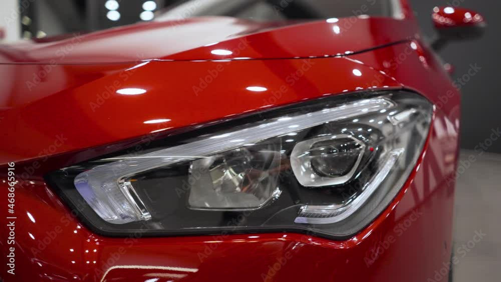 Close up of details of headlights of anonymous prestigious black luxury modern car. Concept of passion for driving cars, car dealerships,luxury cars. Shot in 4K. Head light. Close up of details of headlights of anonymous prestigious black luxury modern car. Concept of passion for driving cars, car dealerships,luxury cars. Shot in 4K. Head light.