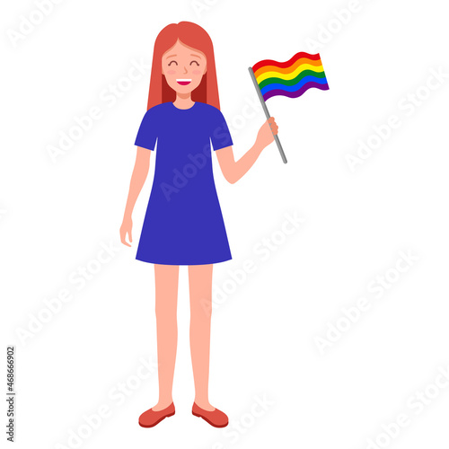Red hair woman holding rainbow flag taking part in the pride parade.