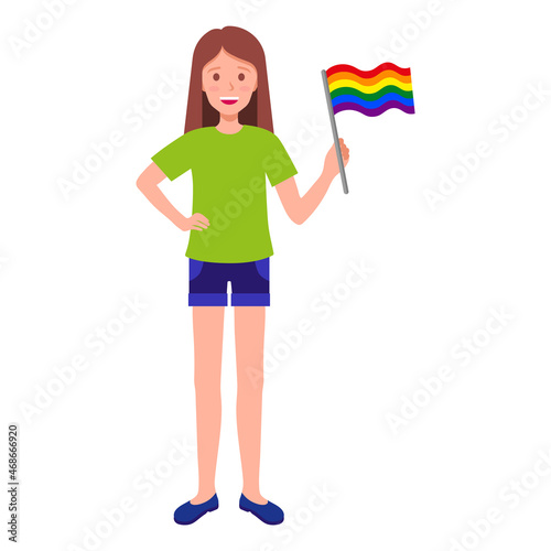 Brunette woman holding rainbow flag taking part in the pride parade.