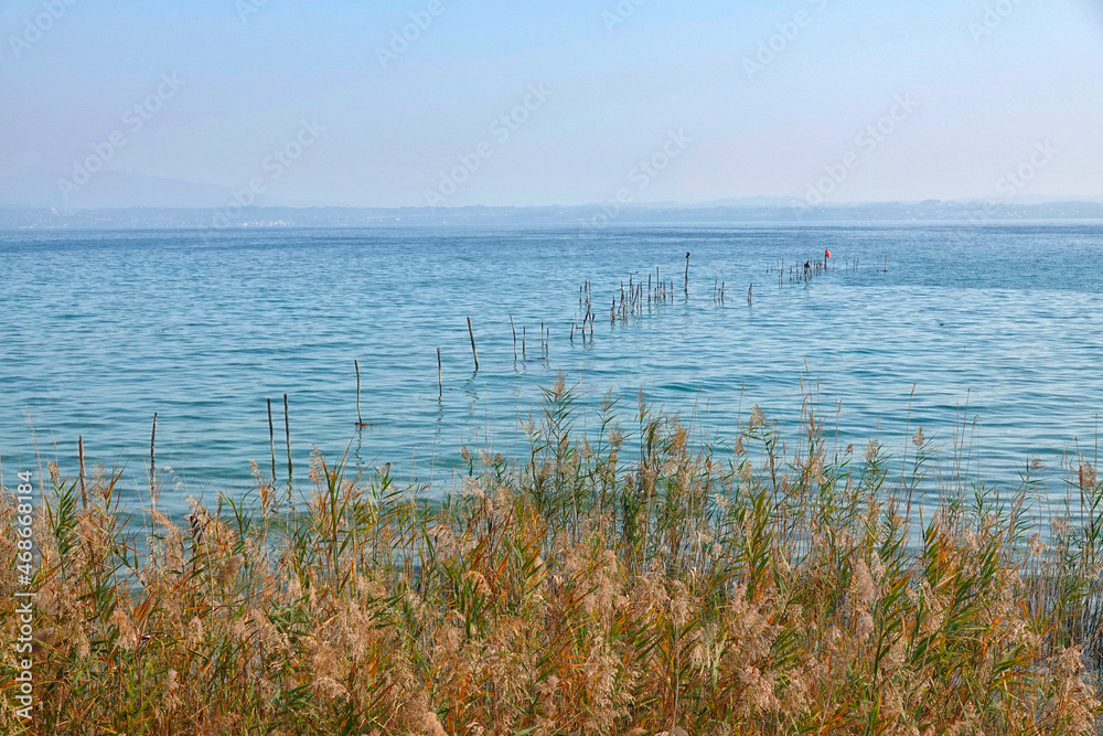 Autumn landscape of Garda Lake at Sirmione, Italy, Europe Autumn landscape of Garda Lake at Sirmione, Italy, Europe