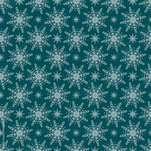 Pattern with snowflakes on a blue background.