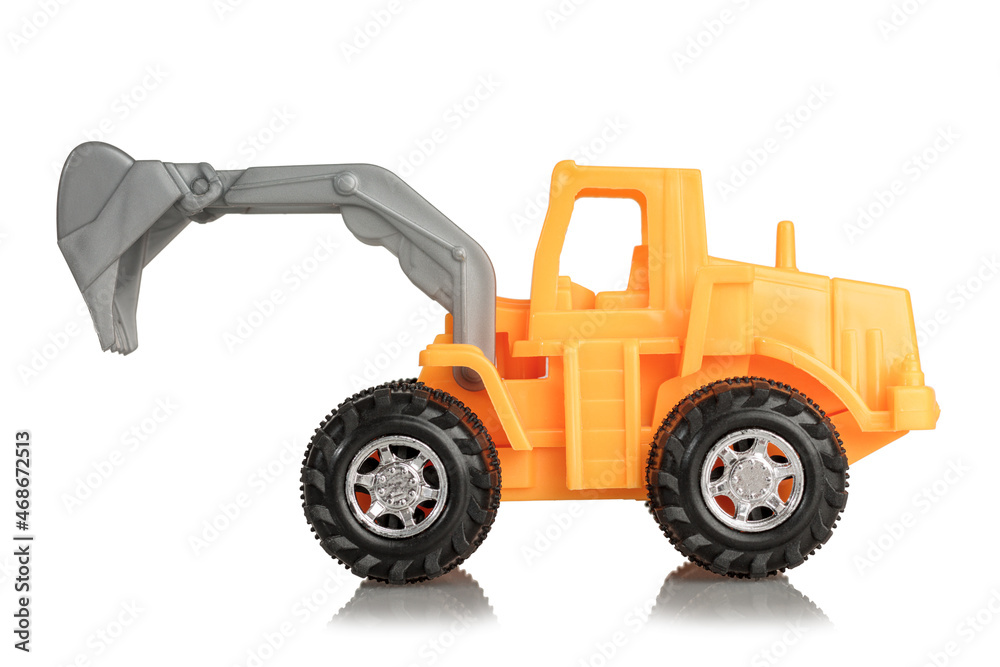 Toy children's excavator with a movable bucket, yellow, isolated on a white background, special equipment for kids Toy children's excavator with a movable bucket, yellow, isolated on a white background, special equipment for kids