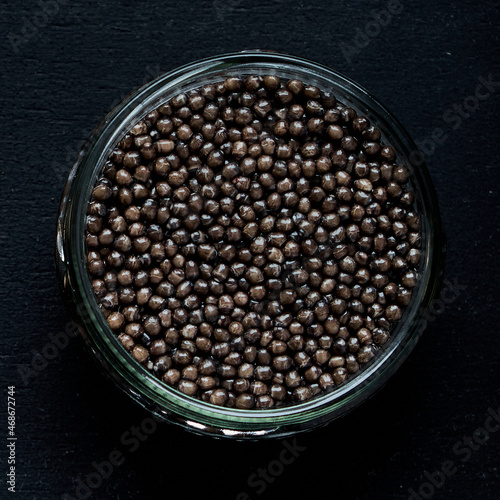 Black caviar close up isolated black background