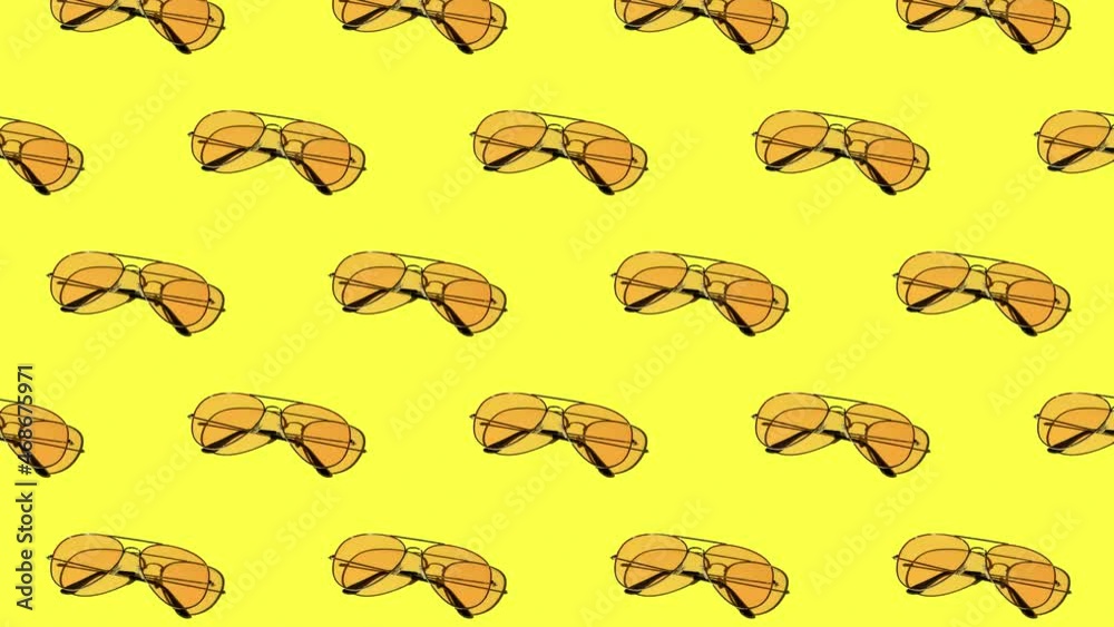 seamless looping animation of a pattern with yellow sunglasses on a bright background. hard shadows from the sun at noon. leisure, travel and entertainment concept with copy space seamless looping animation of a pattern with yellow sunglasses on a bright background. hard shadows from the sun at noon. leisure, travel and entertainment concept with copy space