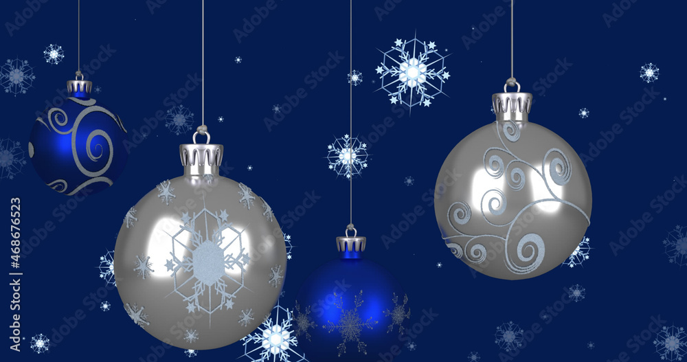 Image of christmas baubles over snowflakes on blue background Image of christmas baubles over snowflakes on blue background